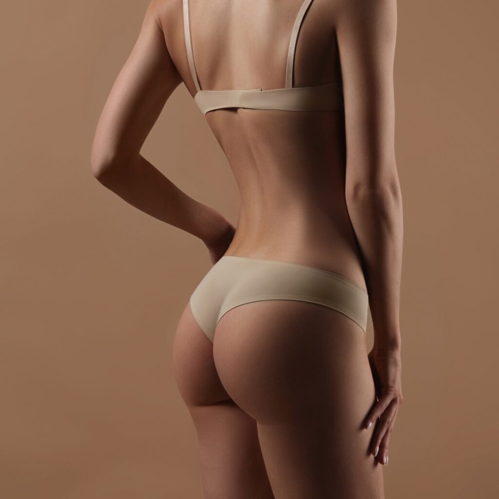 Young woman showing her backside