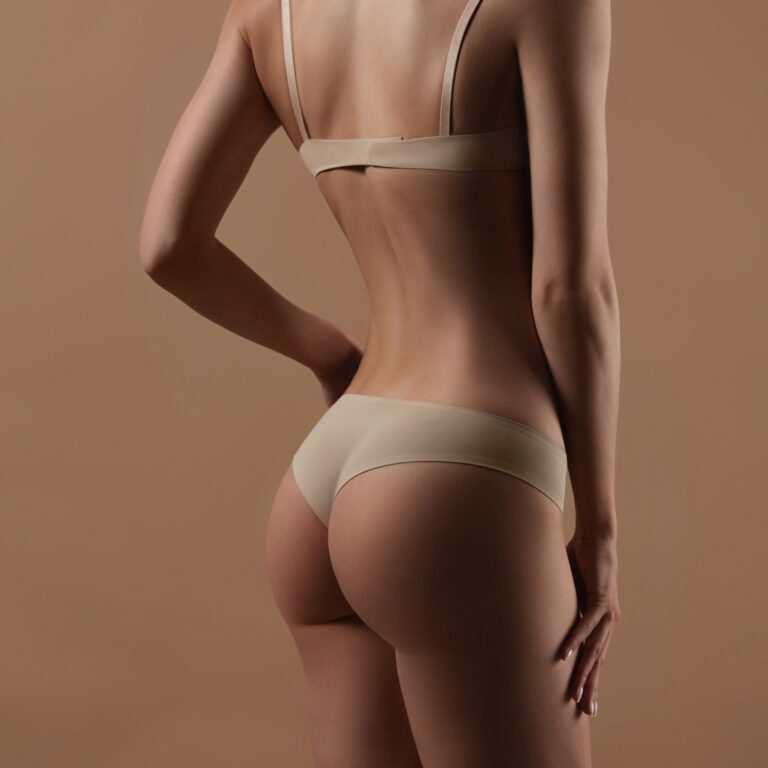 Young woman showing her backside